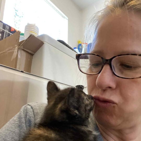 Paw Patrol Dayton's June 2025 Volunteer of the month, Barb, with a dog.