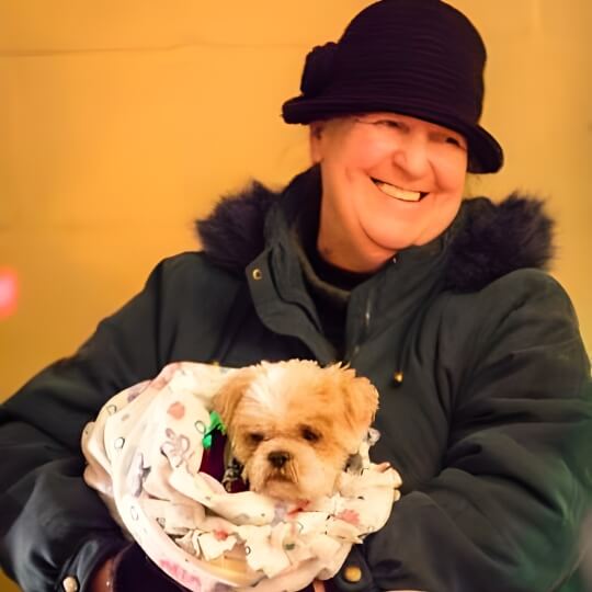 Paw Patrol Dayton's June 2025 Volunteer of the month with two dogs.