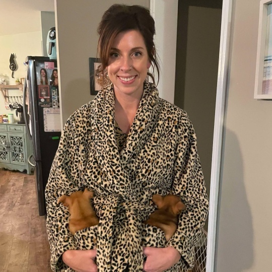 Paw Patrol Dayton's May 2025 Volunteer of the month with two dogs.