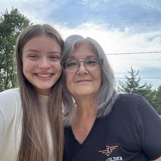 Paw Patrol Dayton's June 2025 Volunteer of the month, Deb, with her dog.