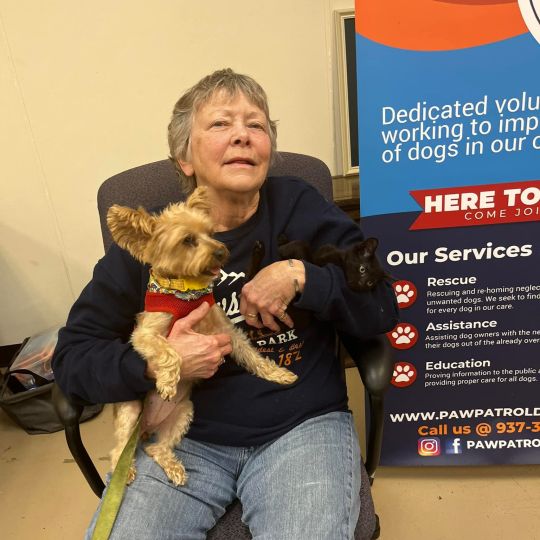 Paw Patrol Dayton's June 2025 Volunteer of the month, Barb, with a dog.
